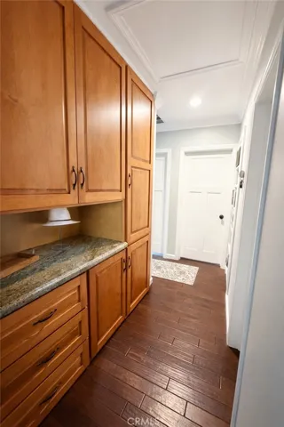Hallway linen area with granite counter top