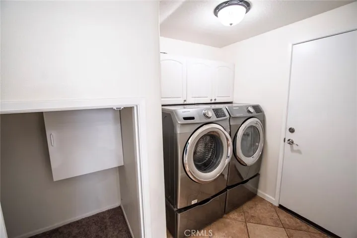 Downstairs dedicated laundry room with large storage closet to the left