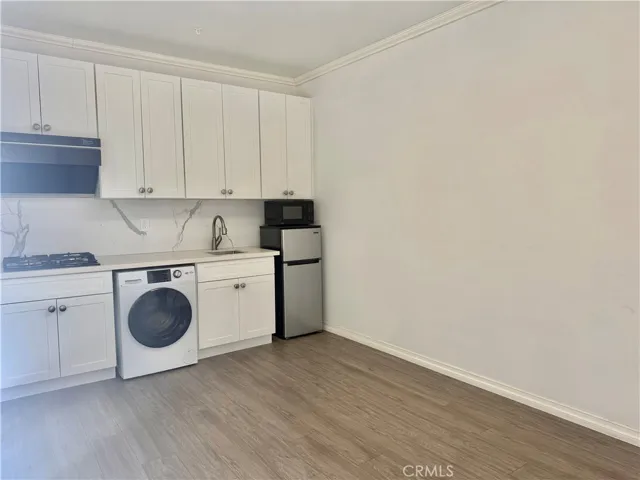 Kitchen with Washier/Drier/Stove