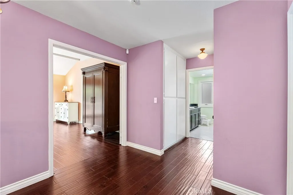 Top level with primary suite and secondary bedrooms serviced by full bathroom