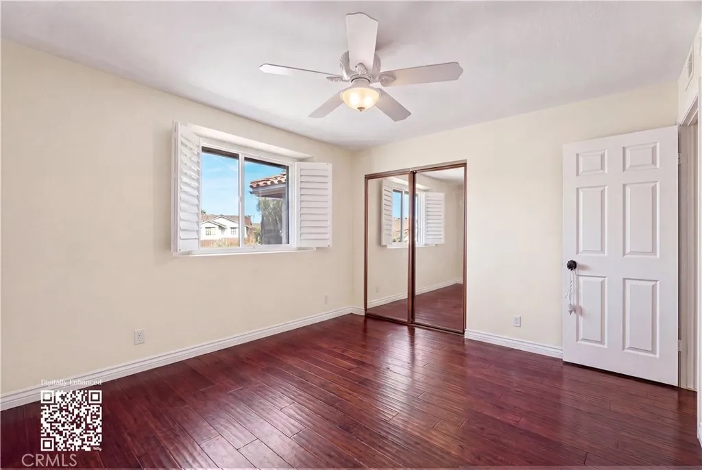 Top floor bedrooms with ceiling fan and wooden shutters. Personal items digitally remove, find originals here https://bit.ly/3OvKmPn