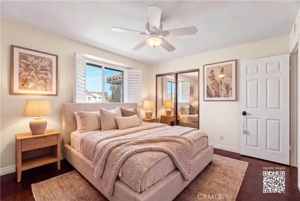 Top floor bedrooms with ceiling fan and wooden shutters. room virtually staged, find originals here https://bit.ly/3OvKmPn