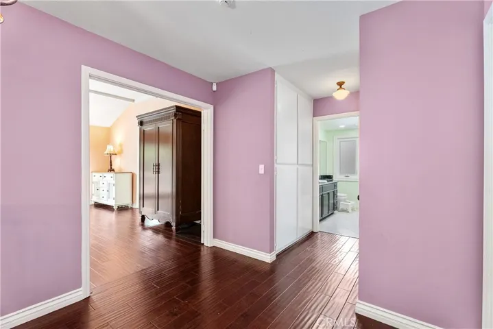 Top level with primary suite and secondary bedrooms serviced by full bathroom