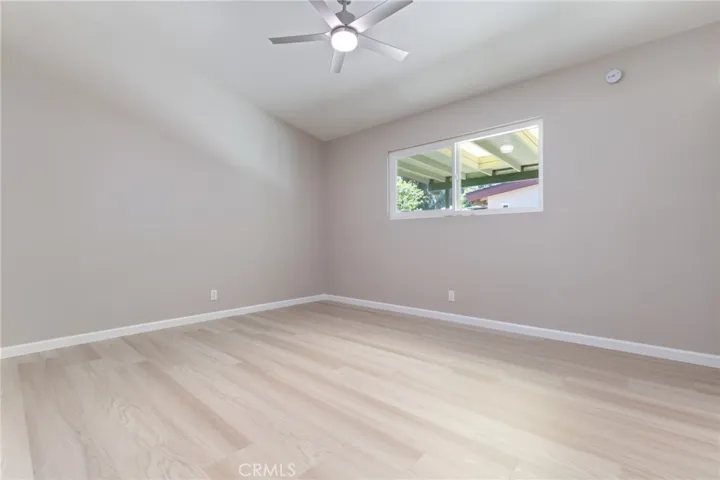 Third bedroom with pitched ceilings and extra closet storage.
