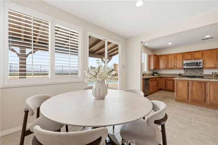 open to kitchen and outdoor living space