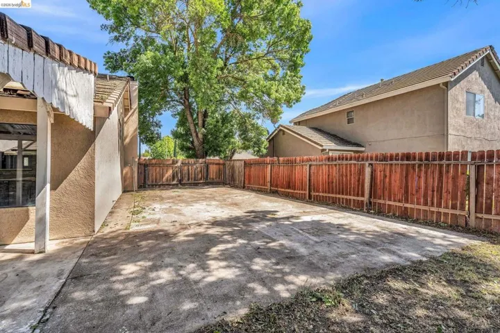 Fenced backyard featuring a patio area