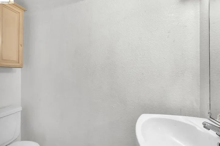 Bathroom featuring toilet and a sink