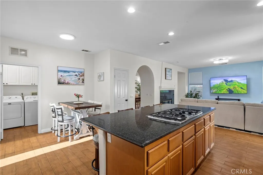 Kitchen with adjacent dining area, offering an open and connected layout