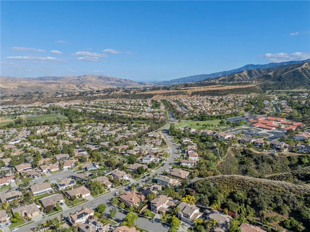 Quiet, well-maintained community with surrounding hills and neighborhood views