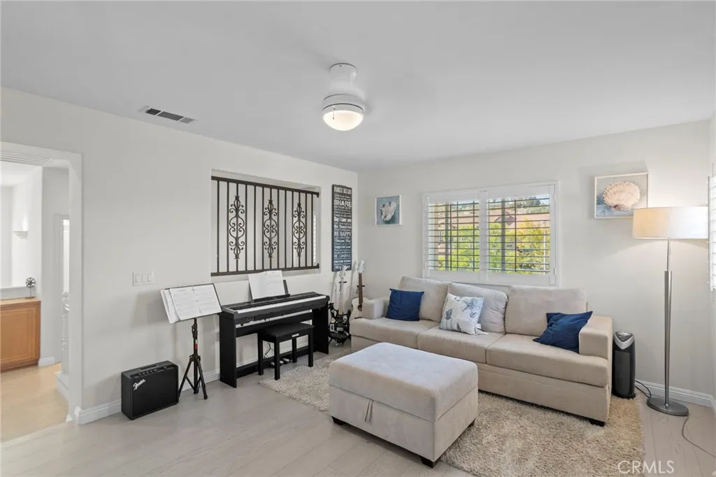 Upstairs loft with a flexible layout for a living area, office, or media space