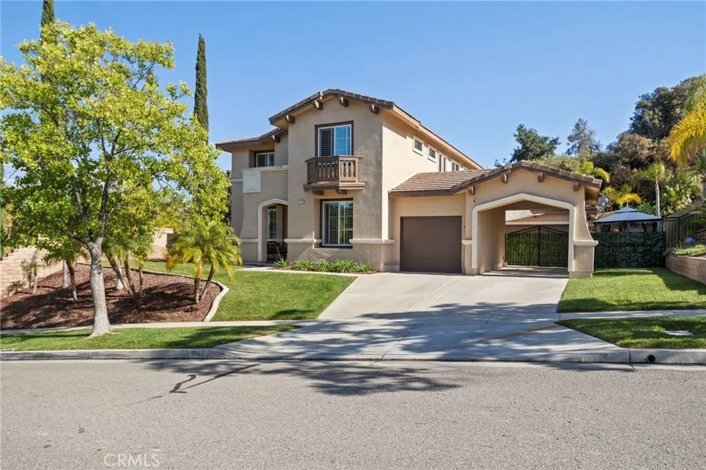 Long, clean driveway leading to a well-maintained exterior and inviting curb appeal