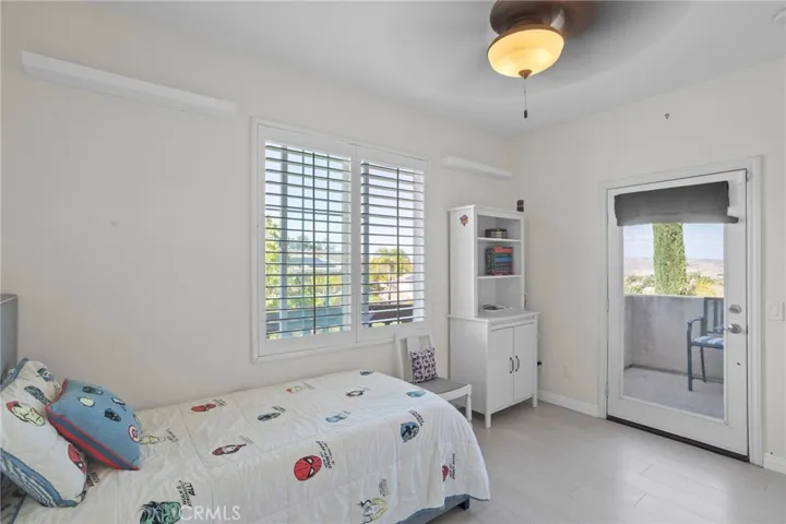 Comfortable bedroom with private balcony access