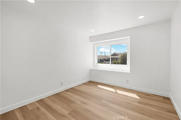 Bedroom 2 featuring high ceilings, natural light, and a clean, open​​‌​​​​‌​​‌‌​​‌​​​‌‌​​​‌​​‌‌​​‌‌​​‌‌​​​​ layout.