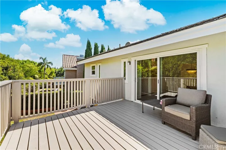Outdoor balcony with sliding door access, offering a comfortable space to relax and enjoy the surroundings.