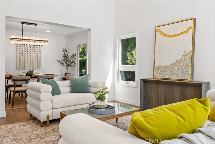 Open living area connecting to dining space, showcasing a bright and cohesive layout.