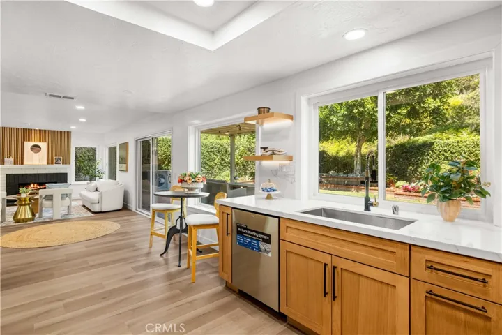 Kitchen view opening to the living area, showcasing a bright and connected layout.