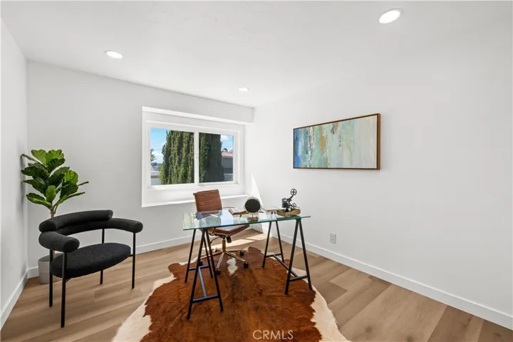 Bright bonus room perfect for an office or workspace, with a simple and functional design.