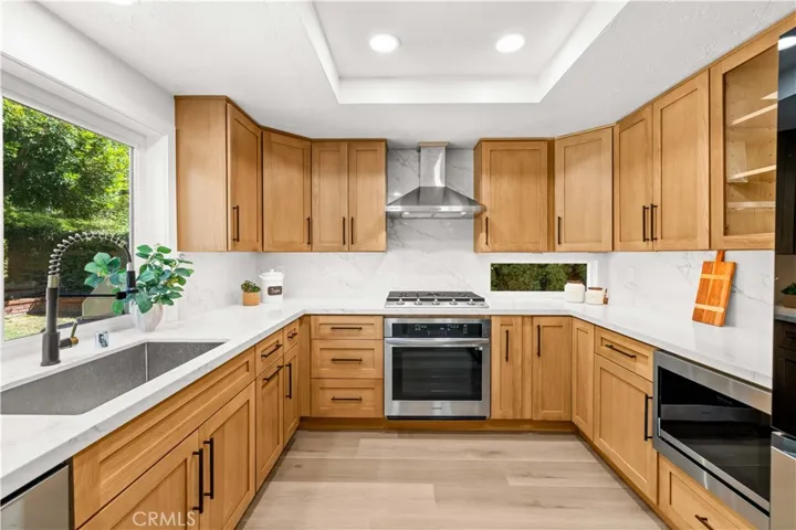 Updated kitchen featuring modern cabinetry, stainless steel appliances, and a clean, functional layout.