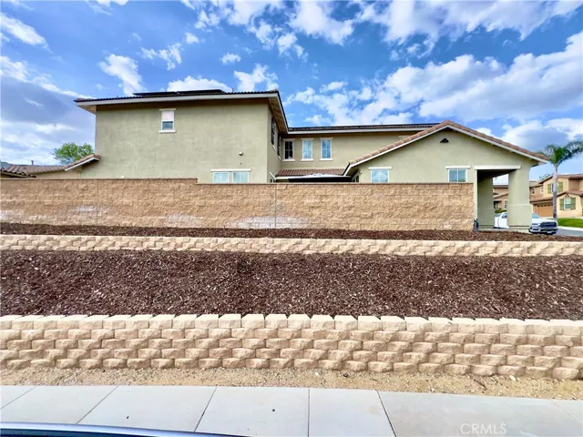 Side view of the corner lot, elevated above the street level.