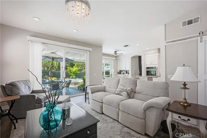 FAMILY ROOM VIEW TO POOL & PATIO AREA
