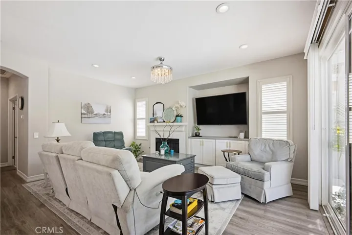 FAMILY ROOM WITH FIREPLACE & SLIDER TO POOL PATIO