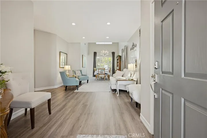 FRONT DOOR ENTRY TO FOYER & LIVING / DINING ROOM