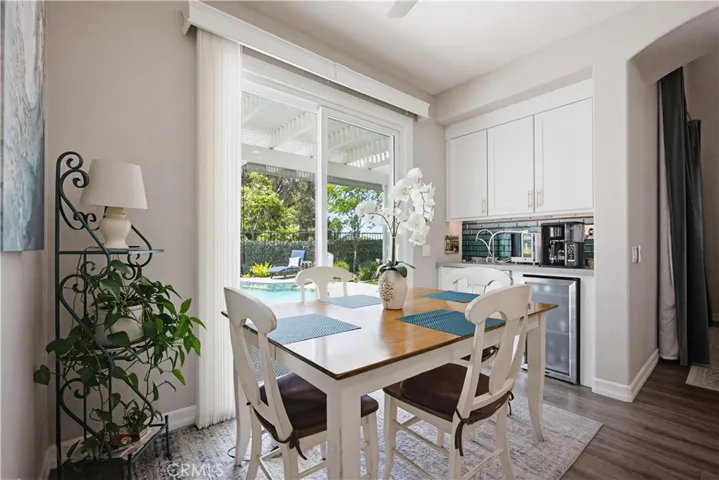 KITCHEN EAT IN NOOK WITH ADDED SLIDER DOOR TO POOL