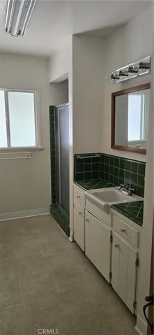 FUL BATH OFF THE HALLWAY. THERE IS A BATH TUB ALSO.