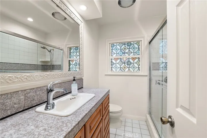 The front bathroom offers a low step-in shower
