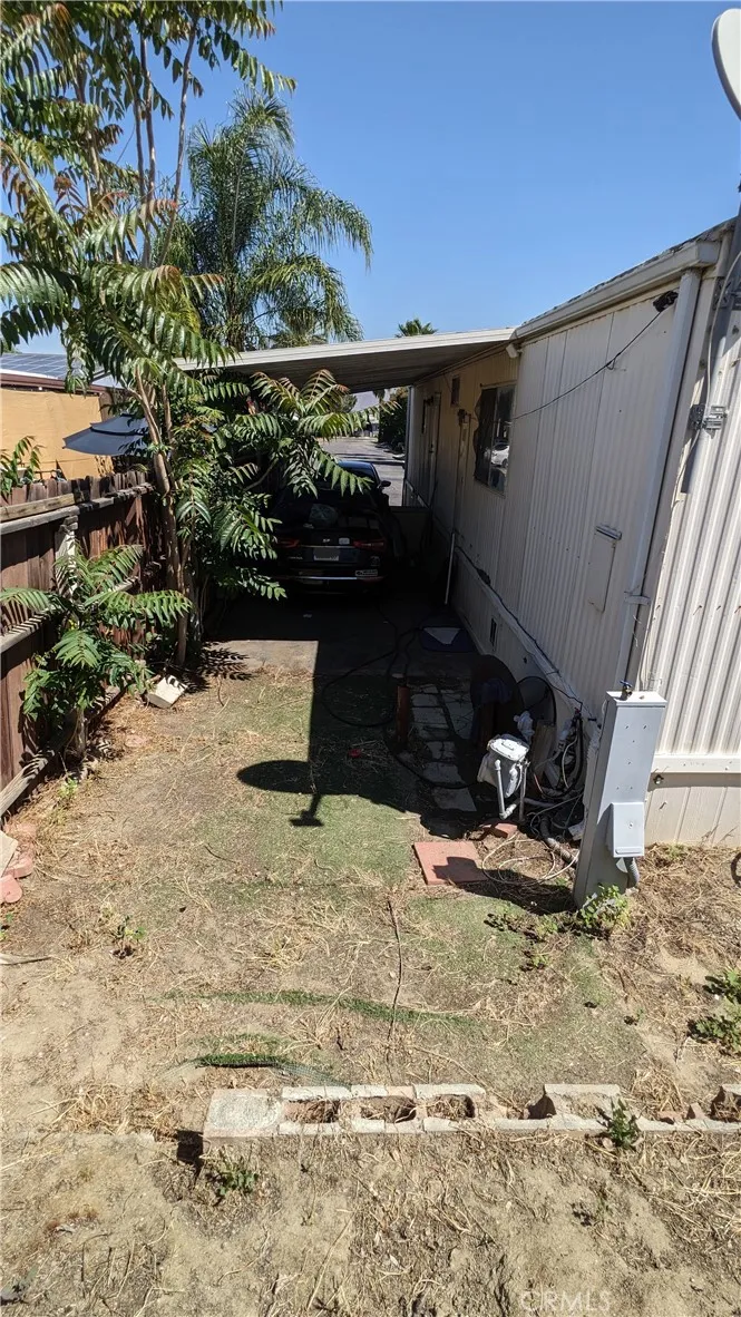 right side of yard, carport side
