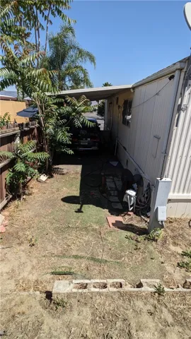 right side of yard, carport side