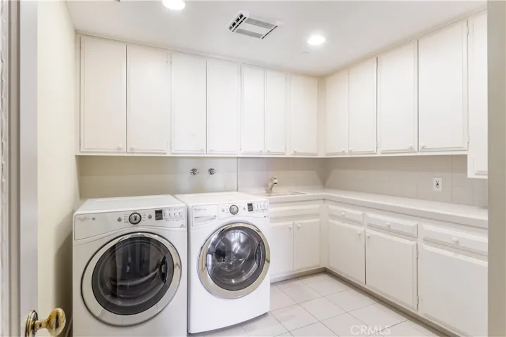 Oversized laundry room with utility sink