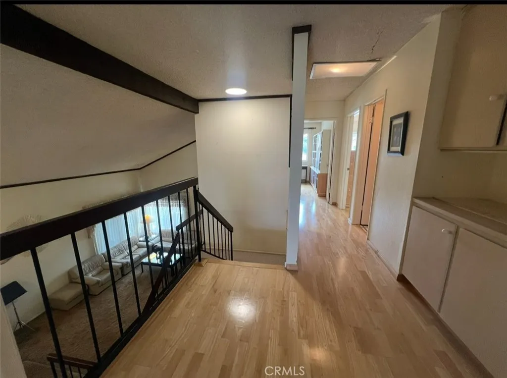 View of the landing in the second floor and the hallway to the two other bedrooms and bathroom upstairs.