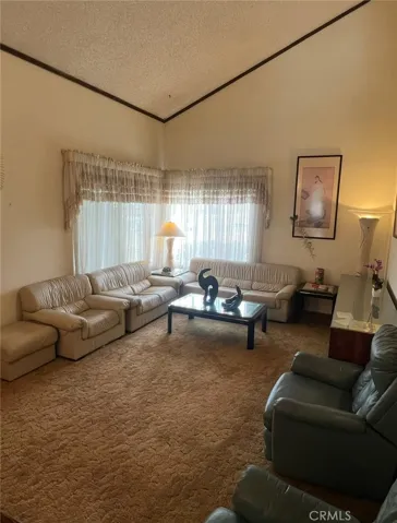 Very Spacious living room that can fit two sets of Living Room furniture plus a piano.