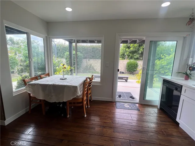 Bright Natural Light that pours into the upgraded kitchen through the double pane windows and sliding glass door giving anyone sitting on the breakfast nook a pleasant view of a variety of fruit trees and plants from the backyard offering a calming retreat at the end of the work day. You can also view your children or pets playing from the comfort of your chair.