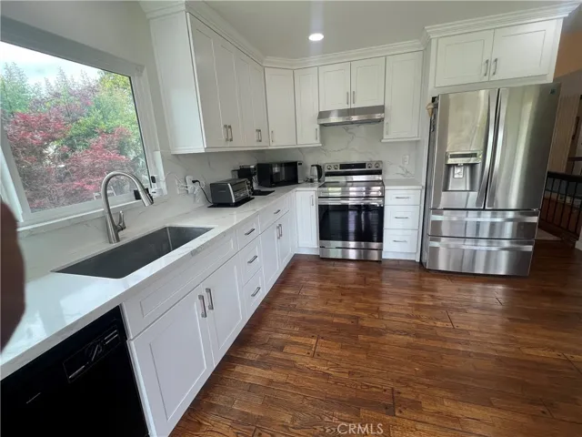 Upgraded kitchen with lots of cabinets and drawers for storage. The sale will include all the appliances currently in the house.