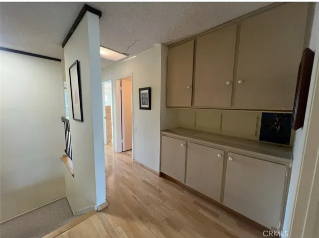 More storage cabinets on the second floor landing upstairs next to the bathroom
