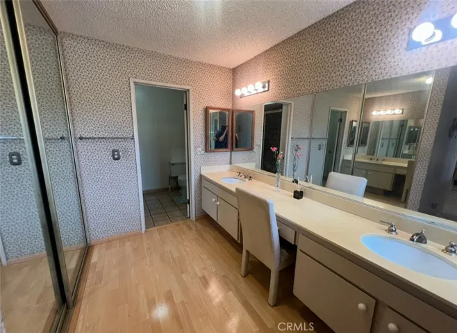Primary Suite's His and Her Sinks and Closets