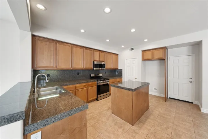 Kitchen granite counters, island and walk-in pantry