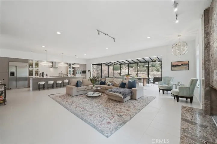 Main living area opens to kitchen and atrium