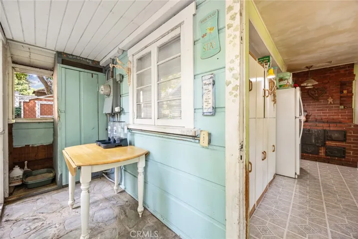 The screened in porch of 13886 Hazel Drive has original stone flooring!