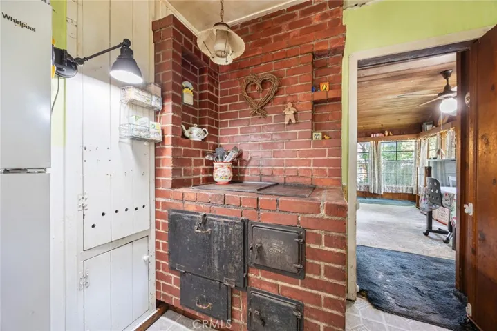 Cook dinner on an original wood burning stove at 13886 Hazel Drive.
