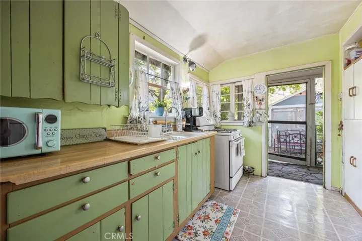 Adorable kitchen of 13886 Hazel Drive has lots of real wood charm!