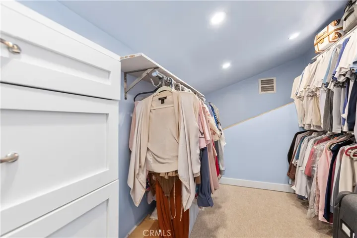Walk in in closet in primary bedroom.
