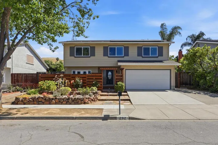 This property has a large side yard to the left - Seller used to park a classic car there.