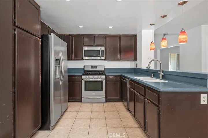 Closer kitchen view highlights the modern finishes, clean surfaces, and functional workspace. The updated look adds style while keeping the room highly usable.