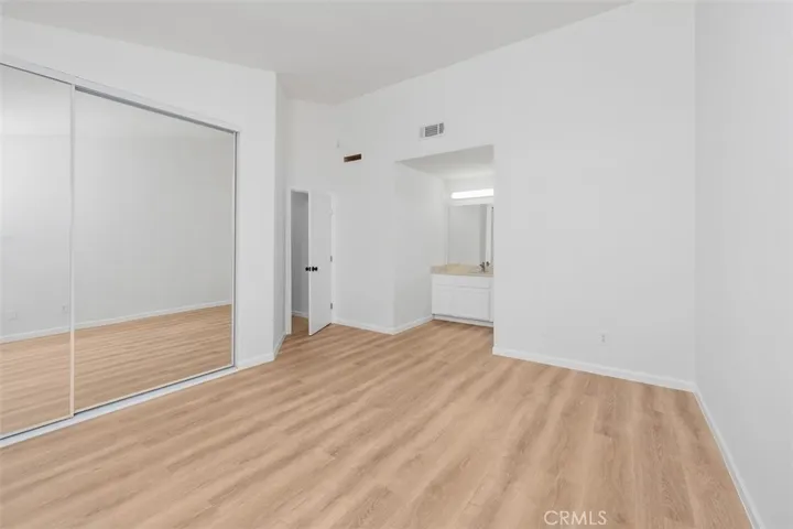 Additional bedroom view shows good natural light and a clean, versatile setup suited for guests, family, or a home office. The neutral finishes make decorating simple.