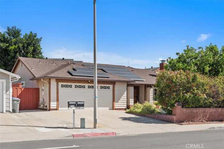 Inviting front exterior with clean lines, refreshed landscaping, and a welcoming approach that gives the home strong curb appeal. The single-story design offers an easy, approachable feel from the moment you arrive.