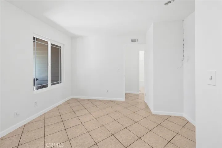 Flexible dining or bonus area offers a bright, open space that can easily adapt to your needs. Its central location supports a comfortable flow between rooms.