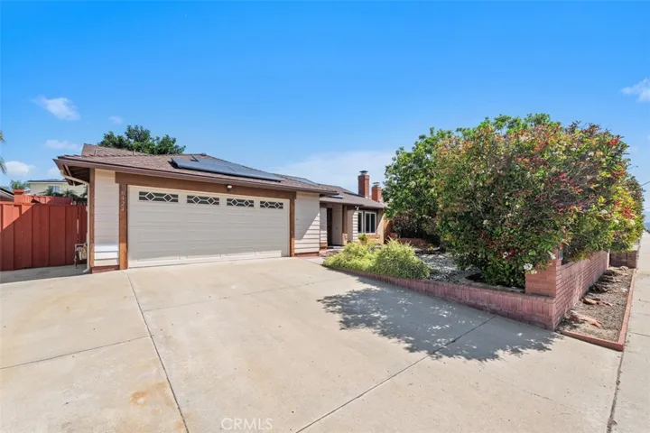Spacious driveway and front entry offer plenty of room for everyday convenience while showcasing the home’s attractive exterior. The layout feels open and functional from the start.